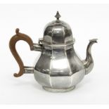 A silver teapot, Goldsmith's Company, London 1901, of octagonal baluster form, 15cm high,