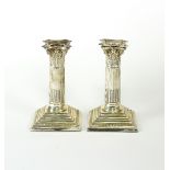 A pair of silver candlesticks, Barker Bros.