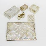 A group of mother-of-pearl items comprising blotter with mother-of-pearl cover, three boxes,
