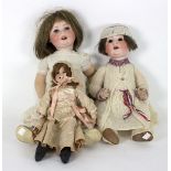 A German bisque head doll with stuffed body, stamped 'AM5/OXDEP, 310',