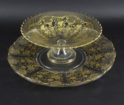 A clear glass bowl and a similar dish, Bohemian or French, circa 1870, decorated in gilt,