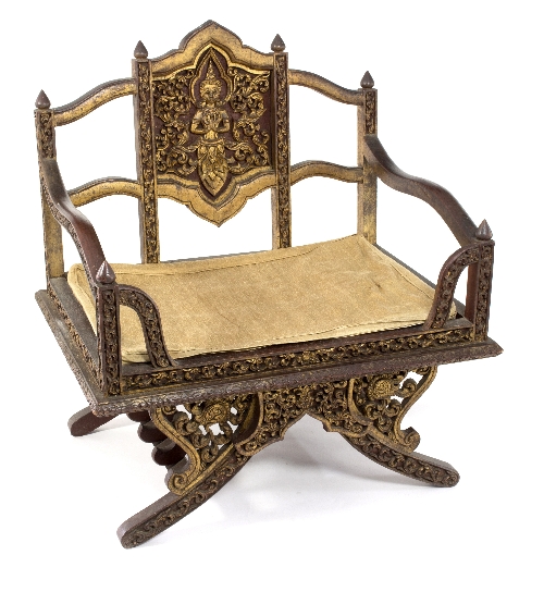 A Cambodian carved frame throne seat, the back panel decorated a deity,