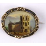 A Victorian painted porcelain plaque, depicting Westminster Abbey, mounted as a brooch,