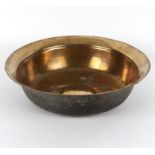 A bossed brass bowl, circa 1700, 45.