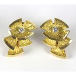 A pair of 18ct gold and diamond ear clips by Cartier, Paris,