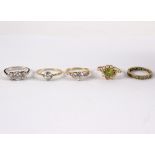 A peridot and seed pearl dress ring to a 9ct gold mount,