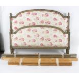 A French bed with painted frame and upholstered head and foot boards,