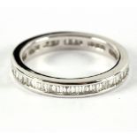 A diamond full eternity ring with channel set baguette diamonds to a white metal mount,