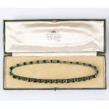 A paste set necklace, the green square cut stones each to a collet setting,