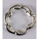 A Georg Jensen 'infinity' silver bracelet designed by Regitze Overgaard, with stylised hoop links,