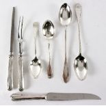 A silver plated three piece carving set, two serving spoons and two basting spoons,