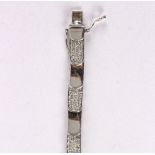 An 18ct white gold diamond set bracelet, the alternate links with millegrain set diamonds,