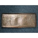 An Art Nouveau copper tray of rectangular form decorated stylised tulips, 57cm wide,