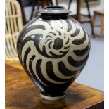 A large stoneware vase of baluster form,