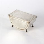 An Art Deco silver casket, Birmingham 1929, of half round form with rectangular hinged cover,