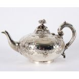 A Victorian silver teapot, Henry Holland, London 1868, with flower finial, initialled to side,