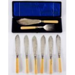 A set of six plated fish knives, the blades engraved with foliage and with silver collars,