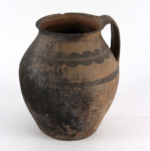 An early pottery jug with red decoration, 24.