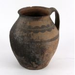 An early pottery jug with red decoration, 24.