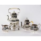 A matched silver tea and coffee service, mostly Elkington & Co, crested,