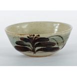 David Leach (1911-2005)/A shallow stoneware bowl in cream speckled glaze with brown foxglove design,