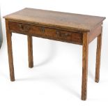 A George III oak side table fitted a single drawer on square chamfered legs, 91.