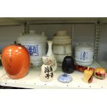 A large Japanese porcelain sake barrel, 38cm high, a smaller example and sundry Japanese vases,