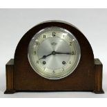 An Art Deco style mantel clock, the silvered dial signed Garrard and with Arabic numerals,