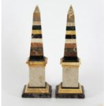 A pair of specimen marble obelisks, one damaged, 43.