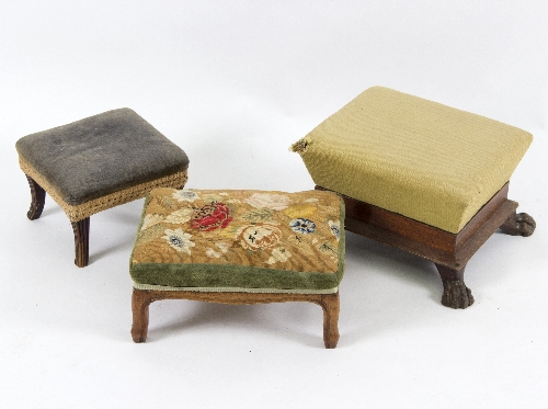 A 19th Century footstool, with paw feet to the corners,