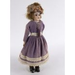 A German bisque head doll, with sleepy eyes, open mouth and teeth,
