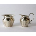 An Arts and Crafts silver sugar bowl, William Davenport, Birmingham 1910 and a matching milk jug,