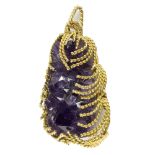 A 1970s amethyst specimen pendant in a cage setting of twisted 9ct gold,