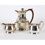 A bachelor's silver coffee set, Birmingham 1947, comprising coffee pot, sugar bowl and cream jug,