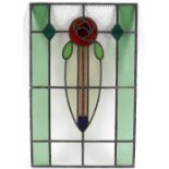 A polychrome stained glass panel in the style of Mackintosh, decorated with a rose,