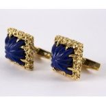 A pair of lapis lazuli cufflinks, circa 1970, set in a textured 18ct gold square frame,