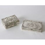 A Continental silver box, the cover decorated figures in a garden, 10cm wide, and another similar,