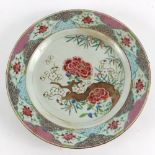 A Chinese famille rose plate enamelled with a flowering branch,
