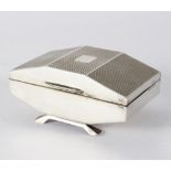 An Art Deco silver jewellery casket, Birmingham 1938, of carved rectangular form,