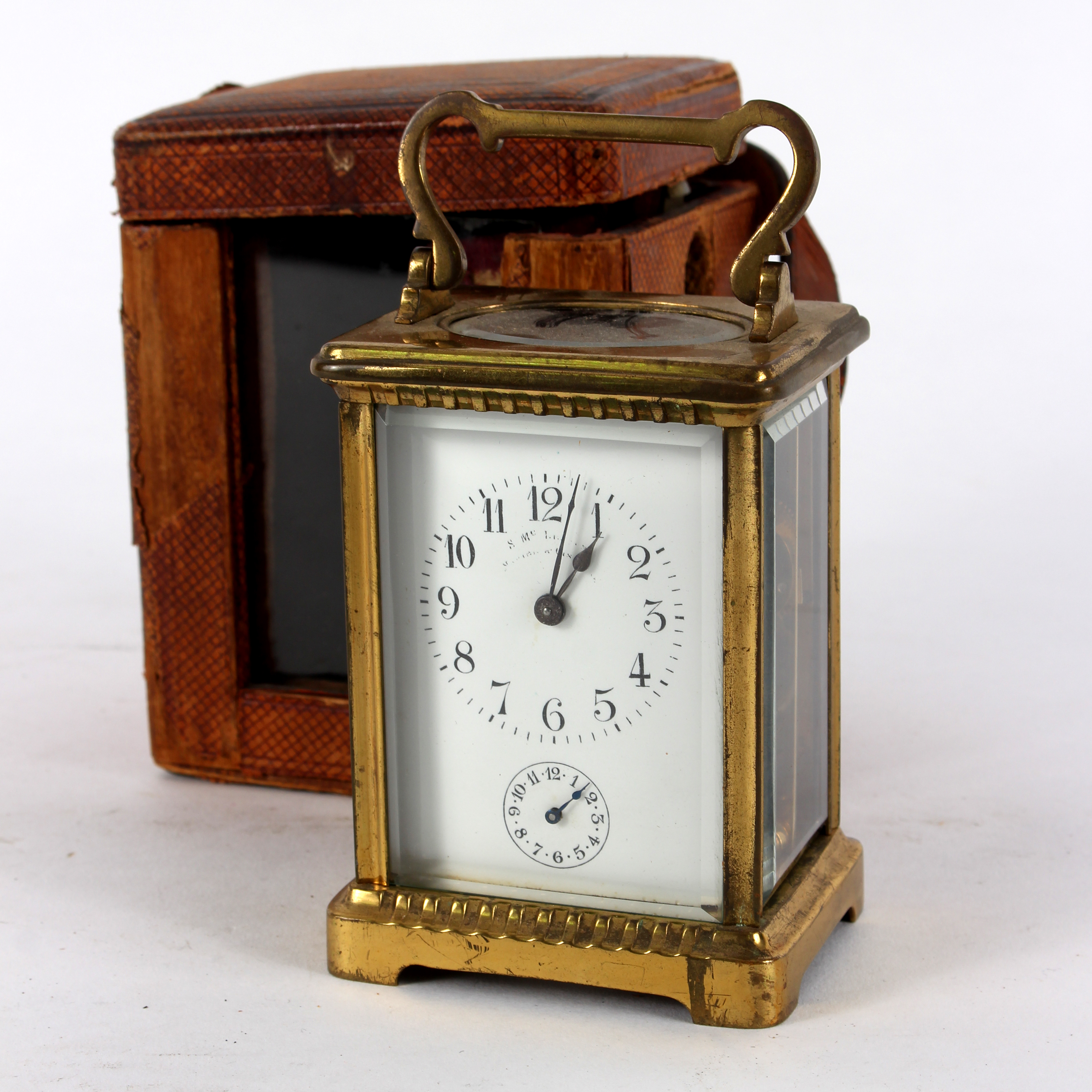 A gilt brass cased carriage clock, the white enamel dial with Arabic numerals and subsidiary dial,