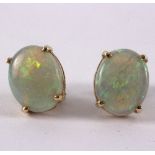 A pair of opal set earrings,