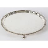 A silver salver, Adie Bros, Bros, Birmingham 1933 with Celtic design to the border on scroll feet,