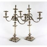 A pair of Sheffield plated two-branch, three-light candelabra,