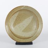 Ray Finch (1914-2012) for Winchcombe Pottery/A shallow stoneware bowl decorated in flecked oatmeal