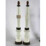 A pair of porcelain column lamp bases, marked Coimbra Portugal,