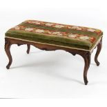 A Victorian rosewood framed stool, with needlepoint seat on carved moulded legs,