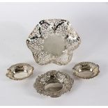 A wavy rimmed silver dish, London 1973, with pierced decoration on a circular foot,
