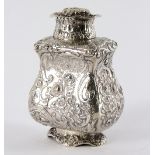 A Continental white metal tea caddy, probably Hanau, profusely decorated flowers and scrolls,