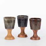 Winchcombe Pottery/Three stoneware goblets,