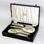A four-piece silver and enamel dressing set, Birmingham 1961,